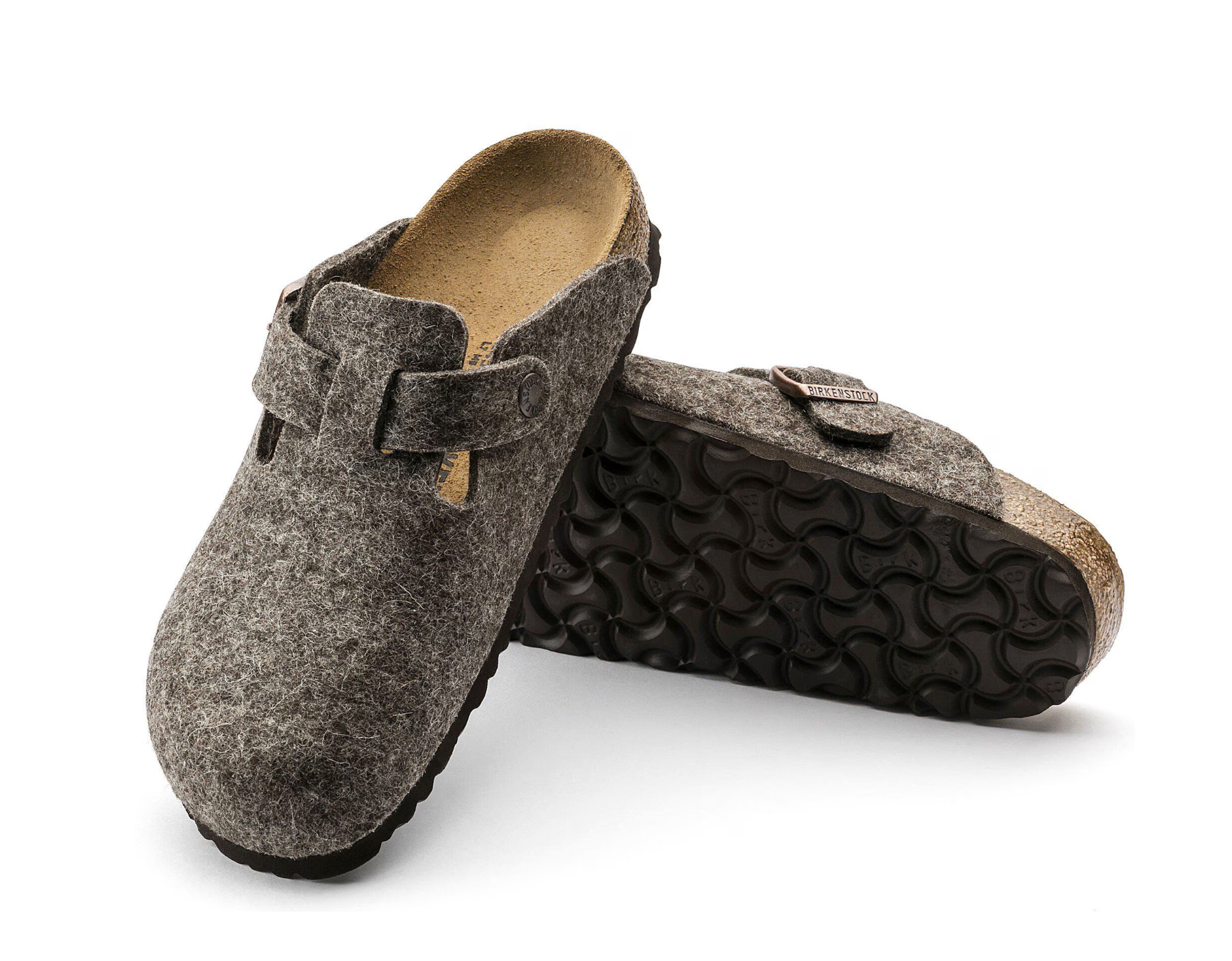 Pair of brown felt clogs on a white background