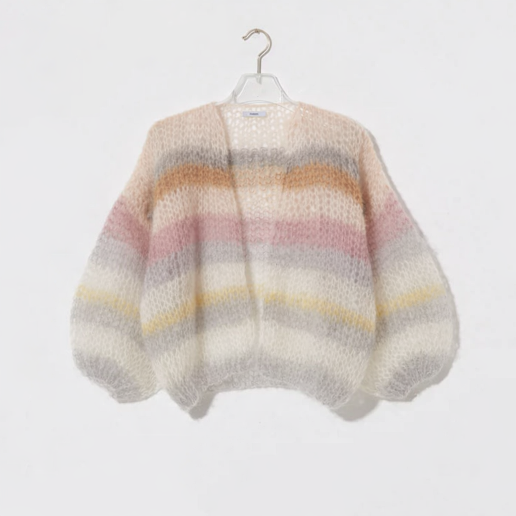 Multicolored striped sweater on a hanger against a white background