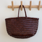 This is the iconic Dragon Diffusion bag, and it remains their bestseller today—a roomy, hand-woven basket in smooth, buffalo calf leather. Handcrafted by artisan weavers in one piece, the diagonal chevron weave is what makes this style unique. And, remaining true to traditional basket weaving techniques, the bag comes unlined with an open top.
