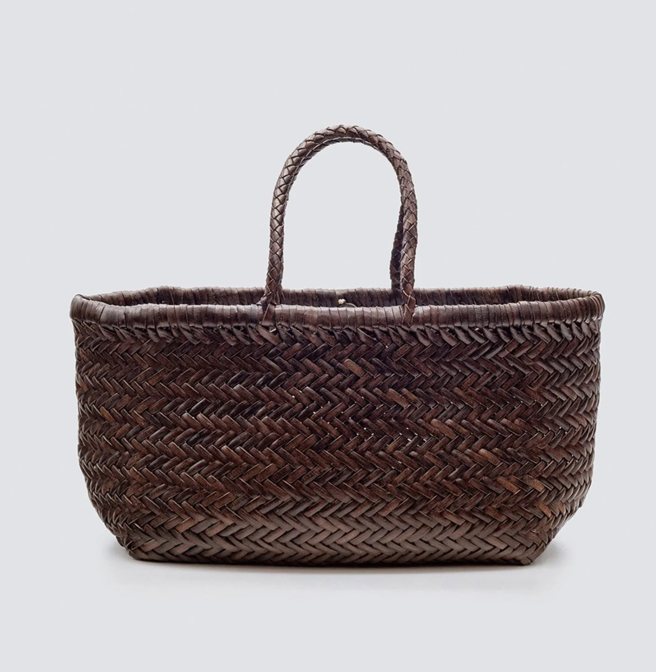 This is the iconic Dragon Diffusion bag, and it remains their bestseller today—a roomy, hand-woven basket in smooth, buffalo calf leather. Handcrafted by artisan weavers in one piece, the diagonal chevron weave is what makes this style unique. And, remaining true to traditional basket weaving techniques, the bag comes unlined with an open top.

Dimensions:

Top Width :  11.8in / 30cm
Bottom Width : 9.8in / 25cm
Length : 8.7in / 22cm
Handle drop length : 5.3in / 13.5cm
Regular price
