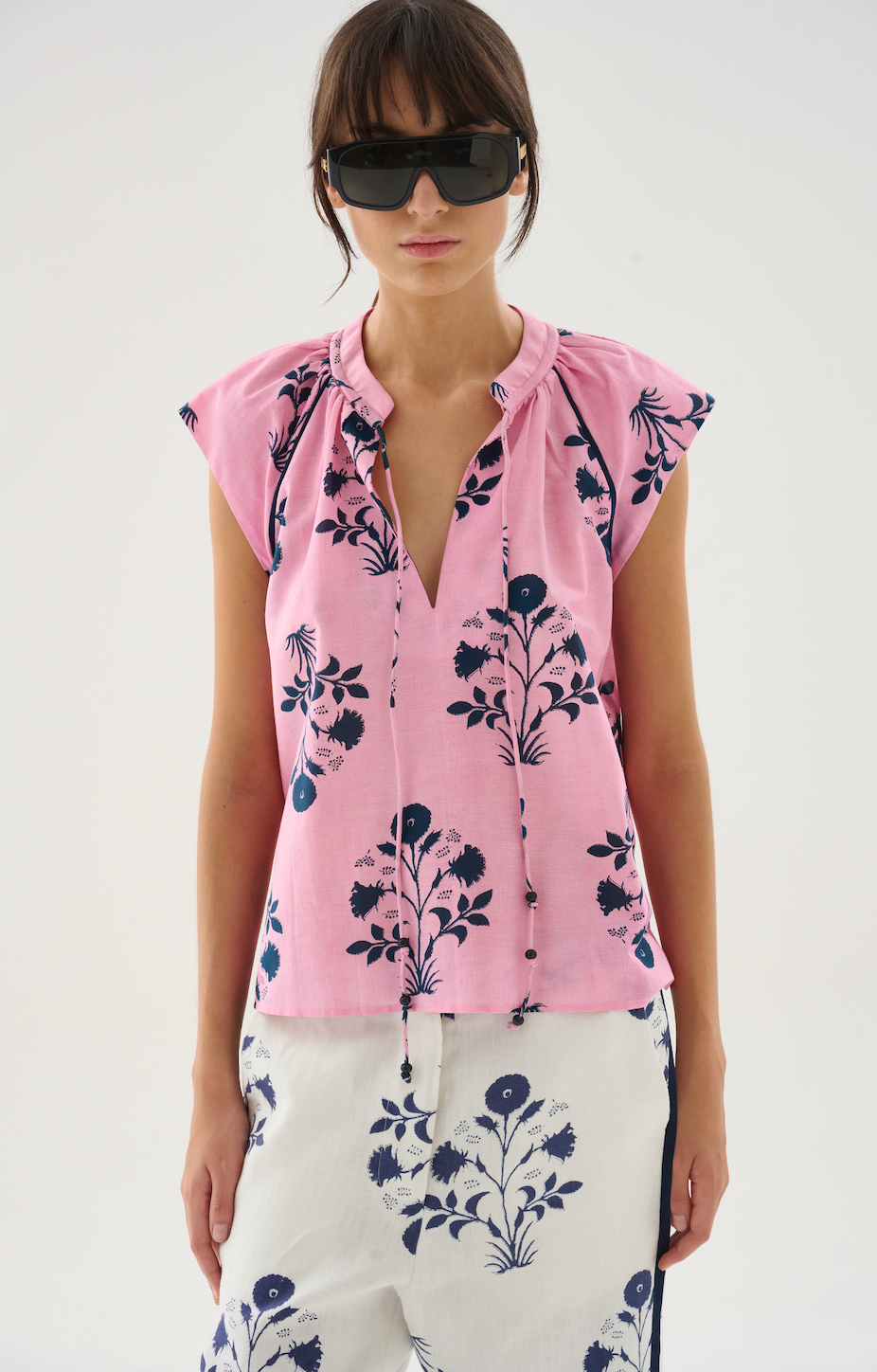 Lightweight and airy, this cotton-silk voile top features a flattering V-neckline framed by soft gathers for subtle volume. Designed with raglan sleeves for a relaxed yet refined silhouette, it's an effortless piece that blends comfort with sophistication.

80% Cotton 20% Silk Voile. 


Do not wash. Do not bleach. Do not iron. Do not tumble dry. Dry clean only. 

Fitting advice - Regular fit.