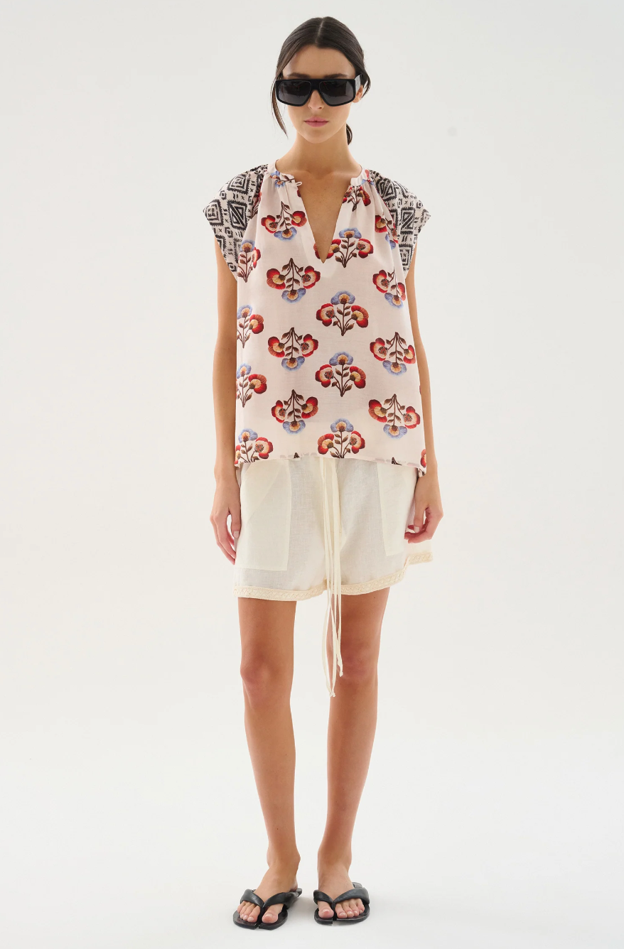 Cupro voile print top , with V-neck with soft gathers along the neckline. Ranglan sleeves.

100% Cupro Voile.

Hand wash with cool water. Do not bleach. Soft Iron. Do not twist. Dry flat in the shade.

Fitting advice - Regular fit.