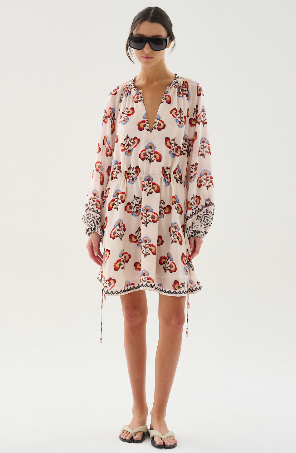 Light and effortless, this short dress is crafted from cupro voile. Designed with a V-neckline that can be fastened with a button, billowy sleeves, and an adjustable waist tie, it balances ease and refinement. Perfect for any occasion.

100% Cupro Voile. 

Hand wash with cool water. Do not bleach. Soft Iron. Do not twist. Dry flat in the shade.

Fitting advice - Loose fit.