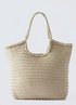 Beige woven tote bag on a light gray background