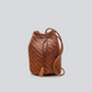 Hand-crocheted from soft goat leather, this unlined, compact shoulder bag features a long shoulder strap and button clasp detail. The fine leather threads are intricately intertwined, creating a textile that is both delicate and dependable. Sling over your shoulder for an unfussy, boho-chic look.

An antiqued St. Christopher medal charm, in homage to the patron saint of travellers, is hand-sewn inside each and every Dragon Diffusion bag—our brand’s very own seal of authenticity.

Width : 5.9in / 15cm
Length