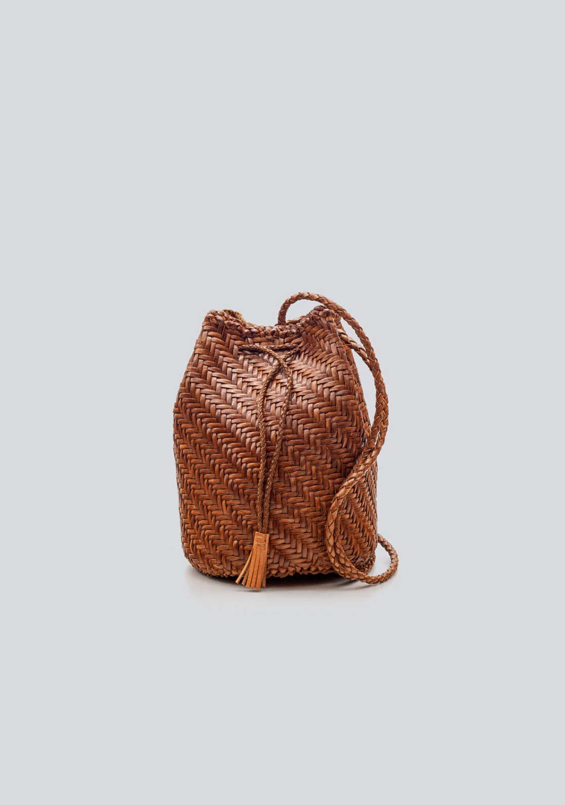 Hand-crocheted from soft goat leather, this unlined, compact shoulder bag features a long shoulder strap and button clasp detail. The fine leather threads are intricately intertwined, creating a textile that is both delicate and dependable. Sling over your shoulder for an unfussy, boho-chic look.

An antiqued St. Christopher medal charm, in homage to the patron saint of travellers, is hand-sewn inside each and every Dragon Diffusion bag—our brand’s very own seal of authenticity.

Width : 5.9in / 15cm
Length