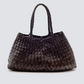 Woven handbag on a light gray background