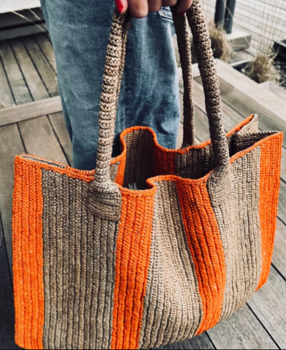 this roomy "weekender" bag can be used as an everyday companion in or out of town, at the beach and/or for traveling.