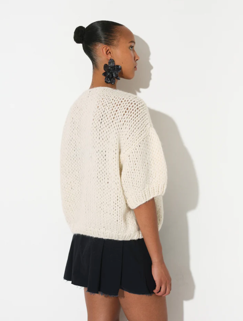 maiami is renown for its hand-knitted luxury knitwear, blending traditional craftsmanship with modern design. This bomber cardigan is made from cotton and alpaca. It is a nice weight from spring, into summer. 