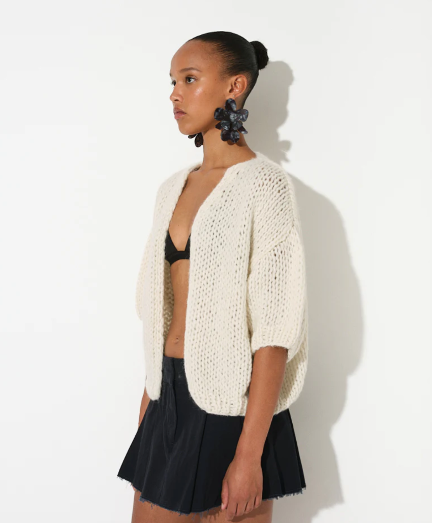 maiami is renown for its hand-knitted luxury knitwear, blending traditional craftsmanship with modern design. This bomber cardigan is made from cotton and alpaca. It is a nice weight from spring, into summer. 