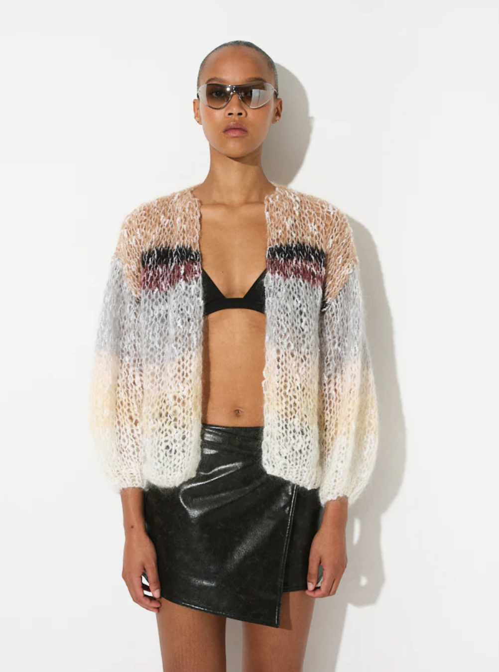 The Boucle Stripes Bomber, a timeless and sophisticated favorite, knit by hand with a luxurious boucle yarn that adds texture and a dry, comfortable touch for the changing season.