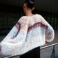 The Boucle Stripes Bomber, a timeless and sophisticated favorite, knit by hand with a luxurious boucle yarn that adds texture and a dry, comfortable touch for the changing season.