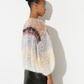 The Boucle Stripes Bomber, a timeless and sophisticated favorite, knit by hand with a luxurious boucle yarn that adds texture and a dry, comfortable touch for the changing season.