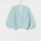 A defining style of the Maiami collection — modern knitwear with softness, character, and ease.