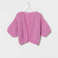 a tactile knit with a relaxed silhouette and short sleeves. Knitted from a fluffy alpaca blend, the cardigan offers warmth with a light, airy feel while the voluminous texture gives the piece a distinctive handcrafted character.

The shorter sleeve length creates a modern proportion, making it an effortless layering piece for transitional seasons.