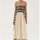 A lightweight midi dress crafted from 100% knitted cotton. Thin, adjustable straps and a smocked back ensure a comfortable fit, while the flowing cotton skirt drapes effortlessly. Finished with delicate contrast stitching along the hem, blending artisanal detail with a modern silhouette.


100% Cotton.

fitting advice - Slim fit.