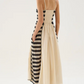A lightweight midi dress crafted from 100% knitted cotton. Thin, adjustable straps and a smocked back ensure a comfortable fit, while the flowing cotton skirt drapes effortlessly. Finished with delicate contrast stitching along the hem, blending artisanal detail with a modern silhouette.


100% Cotton.

fitting advice - Slim fit.