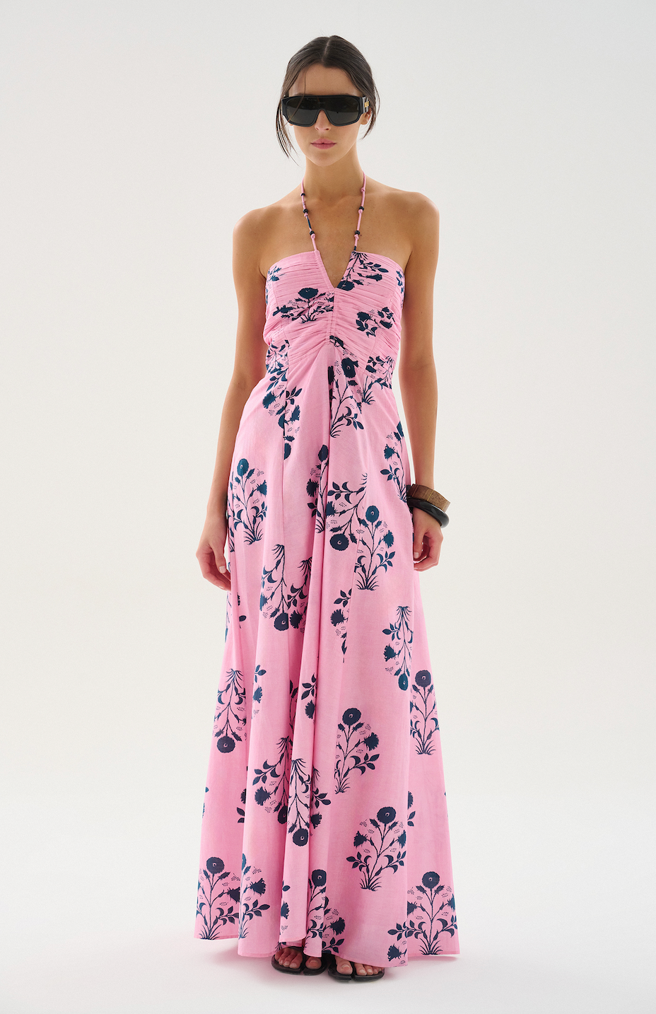 A flowing maxi dress in cotton silk voile, designed for movement and ease. The gathered bodice adds soft texture, while the smocked back ensures a flexible fit. Defined by its effortless drape and floral print. 

80% Cotton 20% Silk Voile.

Do not wash. Do not bleach. Do not iron. Do not tumble dry. Dry clean only. 

Fitting advice - Slim fit.