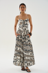 Made from 100% organic cotton poplin, this long dress features a ruched bodice, adjustable thin straps, and a smocked back for a flexible fit. The flowing skirt is finished with an intricate print and side pockets, blending ease with thoughtful detail.

100% Organic Cotton Poplin.

Hand wash with cool water. Do not bleach. Soft Iron. Do not twist. Dry flat in the shade.

Fitting advice - Slim fit.