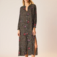 Midi dress with straight fit.

V-neck with buttons from chest all the way down the front of the dress.

Collarless neckline with long sleeves.