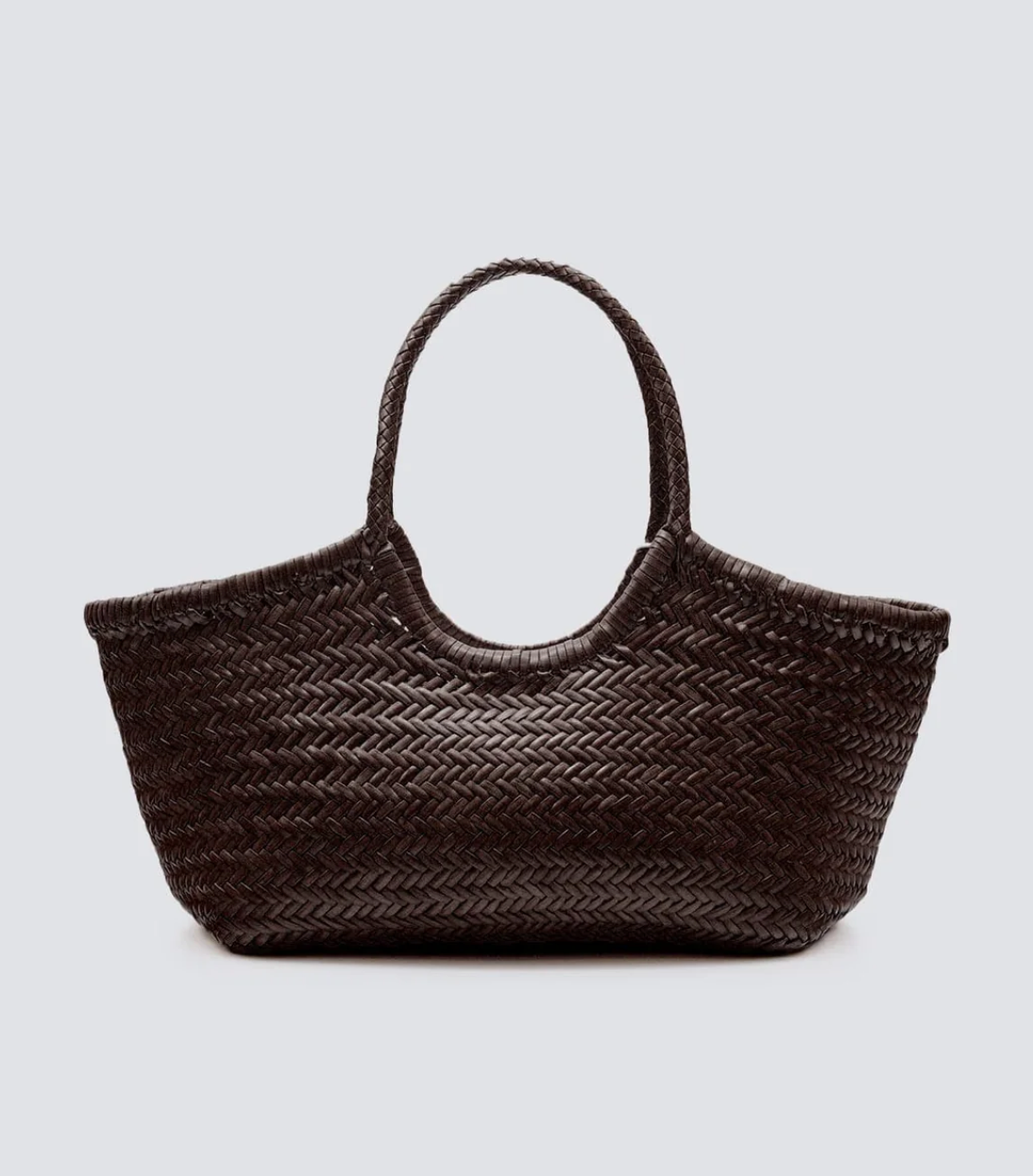 Named after the sunny Massachusetts island, the Nantucket bag is one of our most popular styles. Handwoven in a tight knit from soft buffalo calf leather and complete with braided handles, this roomy, unlined, open-top tote will be the perfect accompaniment to laid-back picnics beneath the summer sun.

An antiqued St. Christopher medal charm, in homage to the patron saint of travellers, is hand-sewn inside each and every Dragon Diffusion bag—our brand’s very own seal of authenticity.
