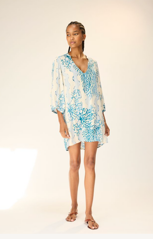 The Maria Dress is a sophisticated mini dress designed with a deep V neckline and an effortlessly flattering silhouette. Its elevated simplicity makes it perfect for pairing with sandals for a relaxed look or styling as a tunic over pants for a more layered ensemble.