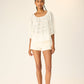 Scoop neck blouse with loose fit.
Puff sleeves with elastic cuffs.