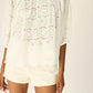 Scoop neck blouse with loose fit.
Puff sleeves with elastic cuffs.