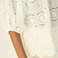 Scoop neck blouse with loose fit.
Puff sleeves with elastic cuffs.