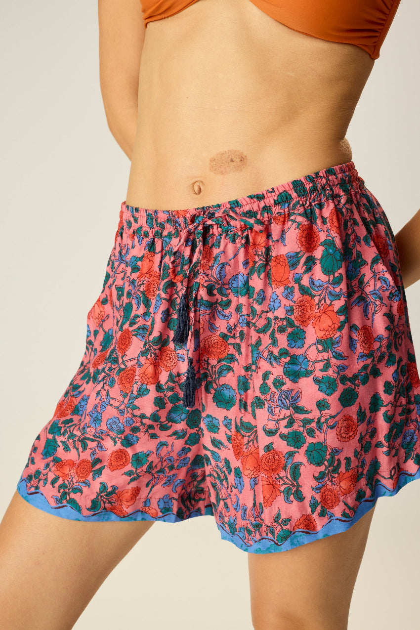 Shorts with elastic drawstring waist. Features pockets.