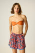 Shorts with elastic drawstring waist. Features pockets.