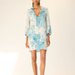 Woman wearing a floral dress on a white background