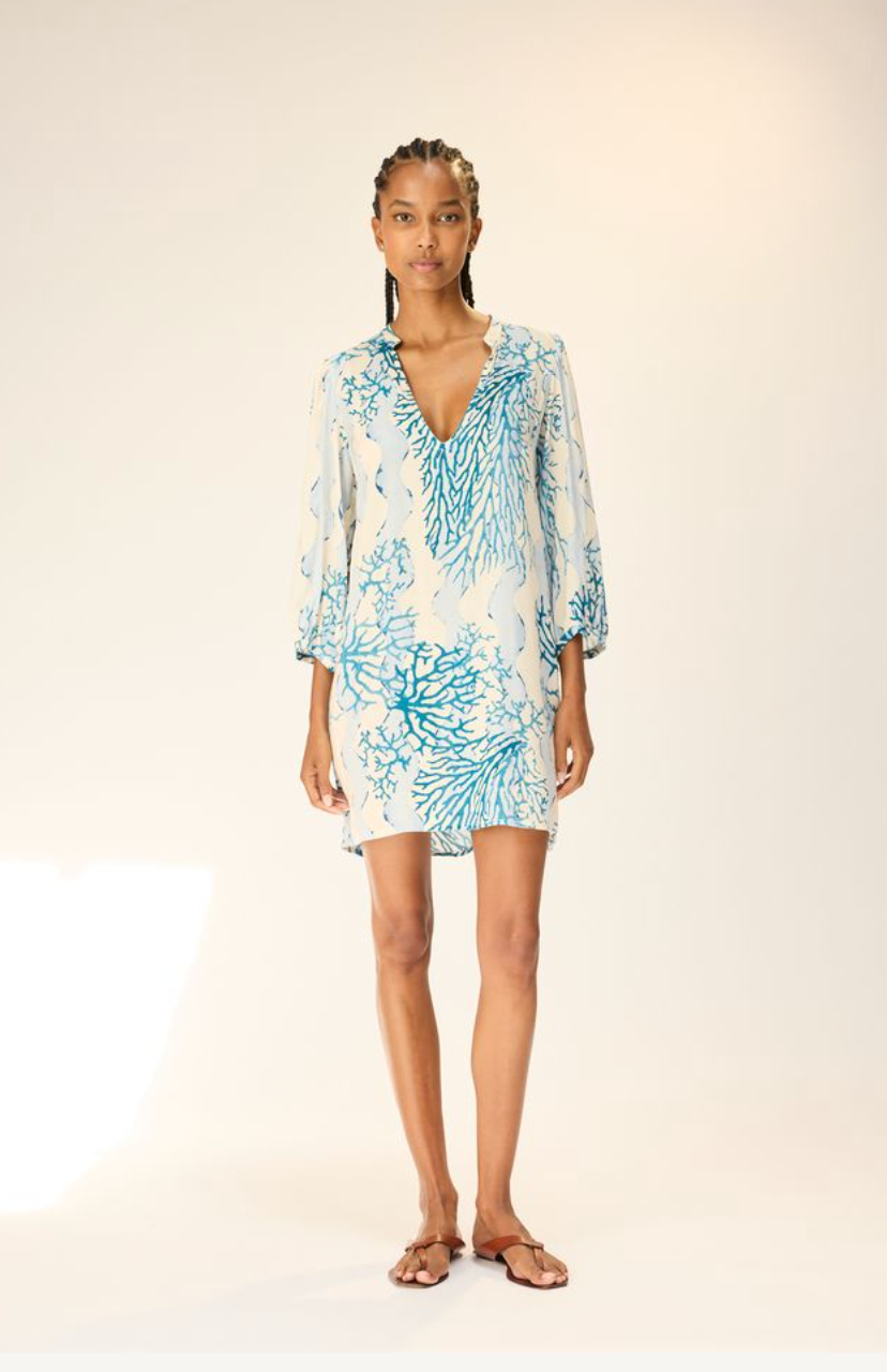 Woman wearing a floral dress on a white background