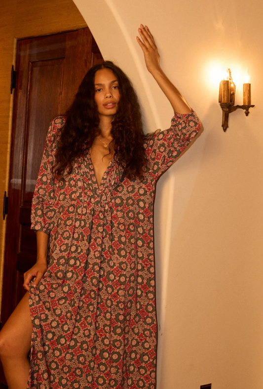 Maxi-length dress with v-neckline and pleated bib.

Three-quarter length sleeves.