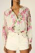long sleeve button down shirt with band collar. flat cuffs with button closure at wrist. slightly pleated under collar and at shoulders to add fullness.