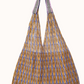 The Épice Paris Udaipur tote Bag 2550 is a standout piece from the brand’s Spring/Summer 2025 collection, blending artistic design with everyday functionality. Crafted in a distinctive triangular mesh shape, this tote features a double-layered mesh construction up to mid-height.
digitally printed, offering depth and vibrancy.
Short woven handles tailored to each colour variant.
Removable inner zippered pouch for added convenience.
Made from 100% polyester, ensuring durability while maintaining a light weigh