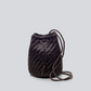 Woven bucket bag with drawstring on a light gray background