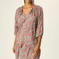 colour spanish tile almond 
Mid-length dress with drop waist.
Gathered collar with four tassels.
Half-sleeve.