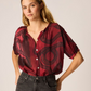 V-neck blouse with shell buttons.

Short sleeves with button closure at cuff.

Slightly pleated under collar to add body.

*The ament print is a fall collab with Seattle-based artist Jen Ament, whose striking hand-carved linocuts take on new life in this inspired collection. 


